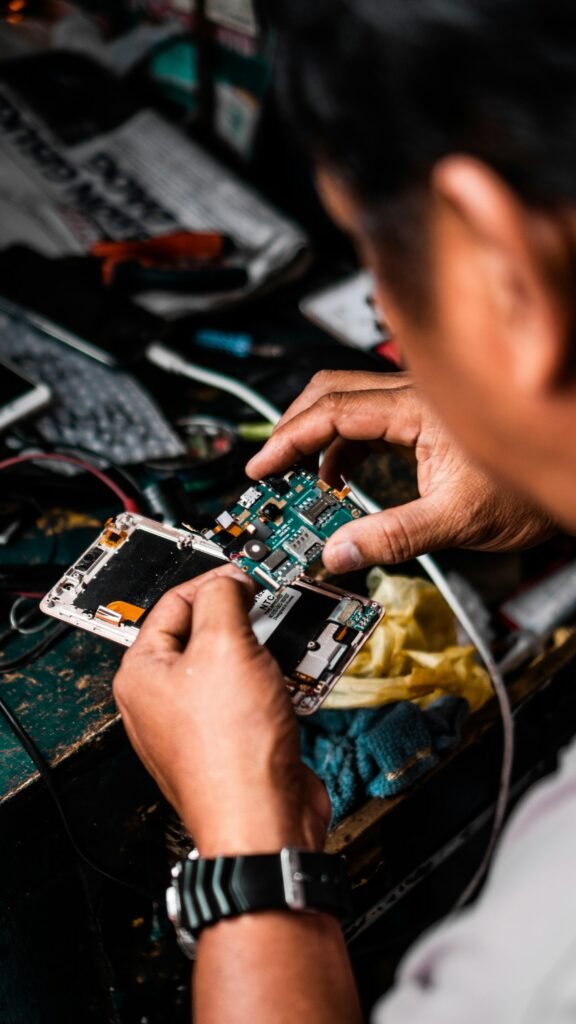 Technician servicing a smartphone at the Gadget Repair LV bench in Las Vegas
