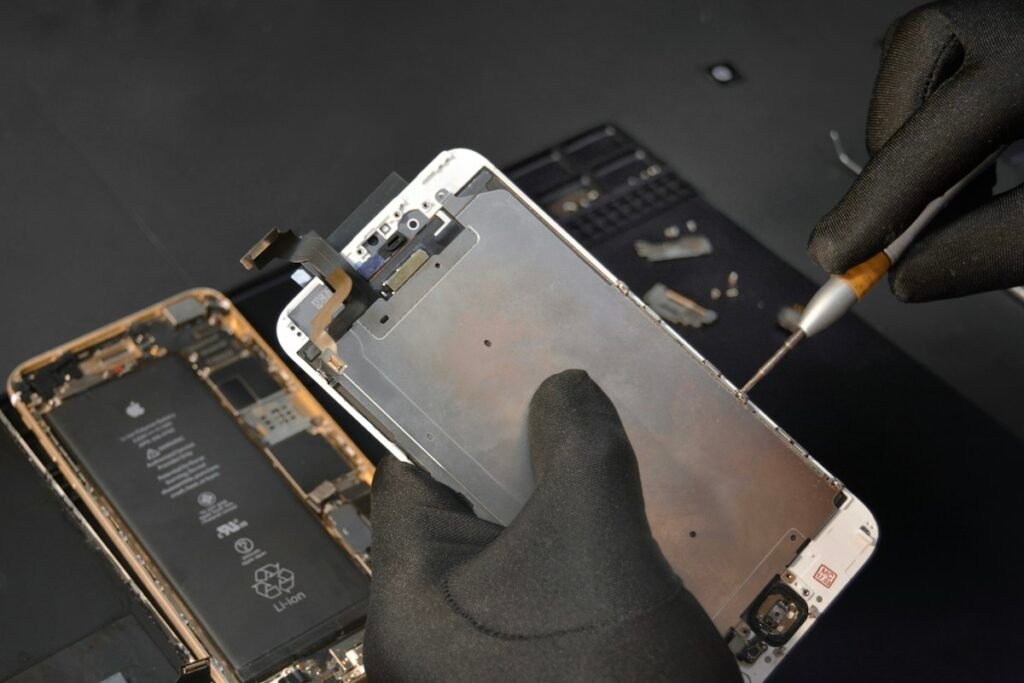 Close-up of a phone being serviced